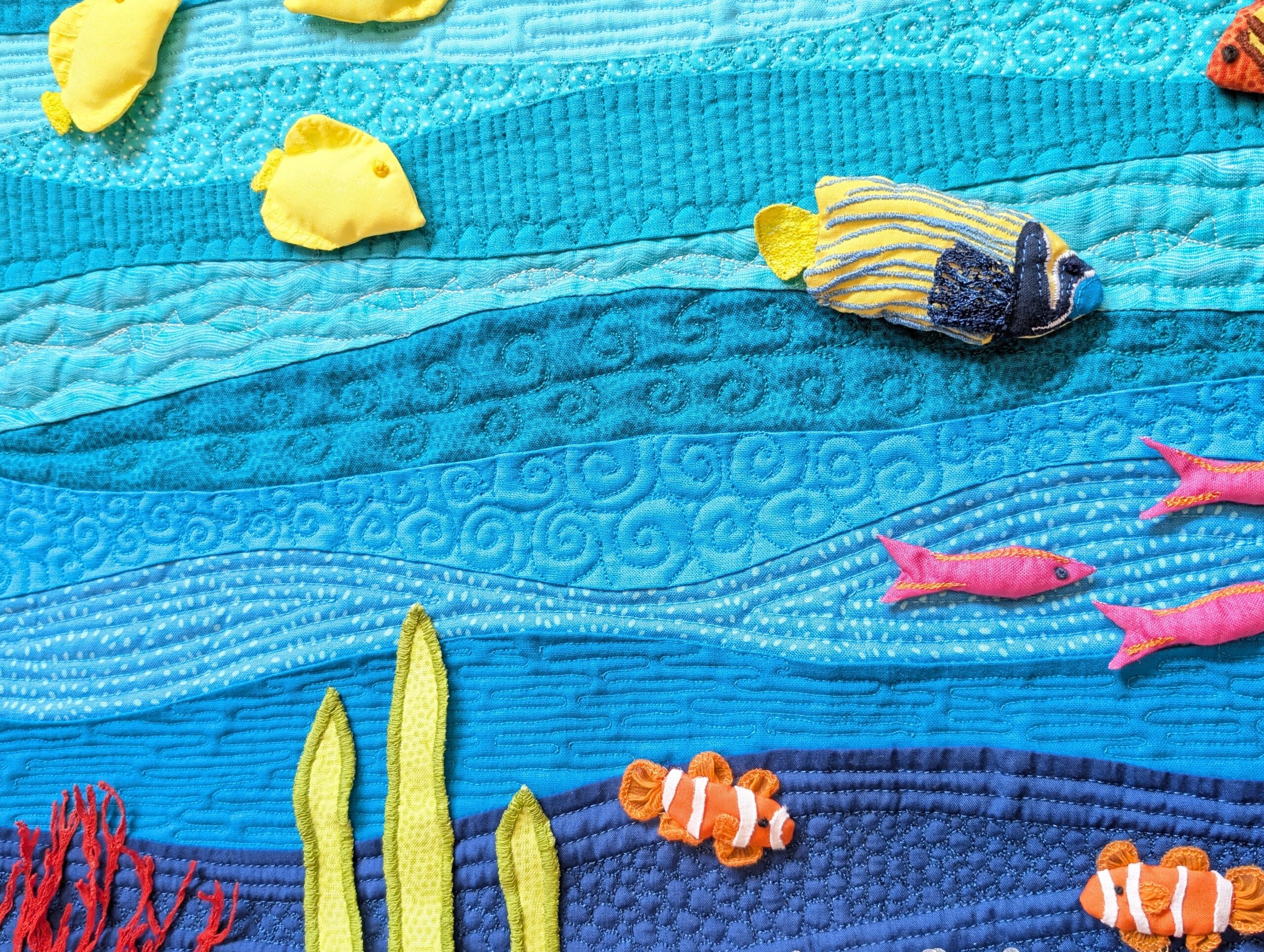 Quilting techniques - close up of Malvern Quilt Show 2026 - Award winning quilt 2026 - Pause and Enjoy... Reef Festivities - Beginners Award - Charlotte Greenman Art